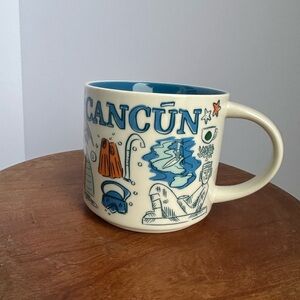 Starbucks Cancún Mug with Blue and Cream Design.